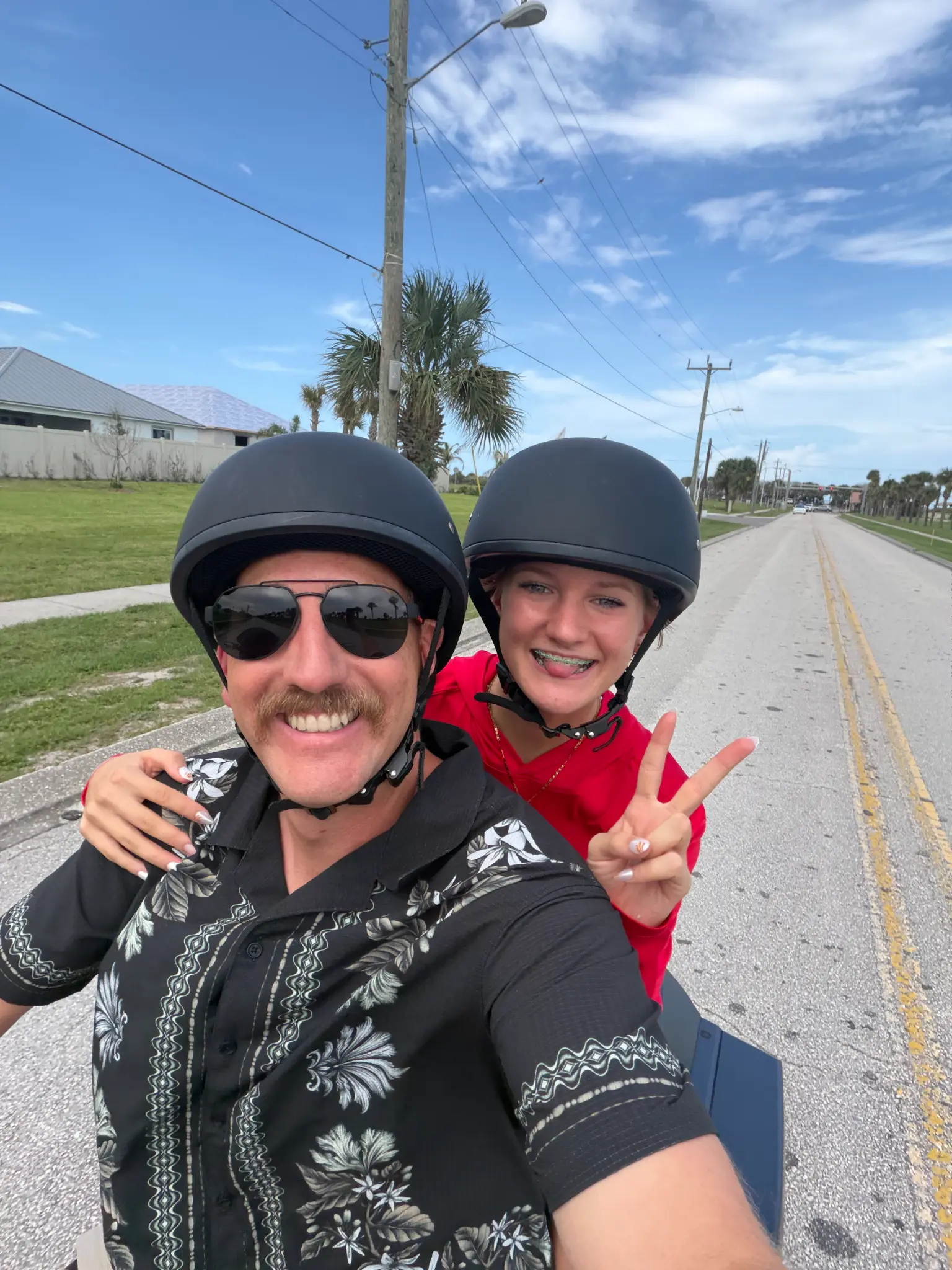 Christian Bear enjoying a scooter ride with family