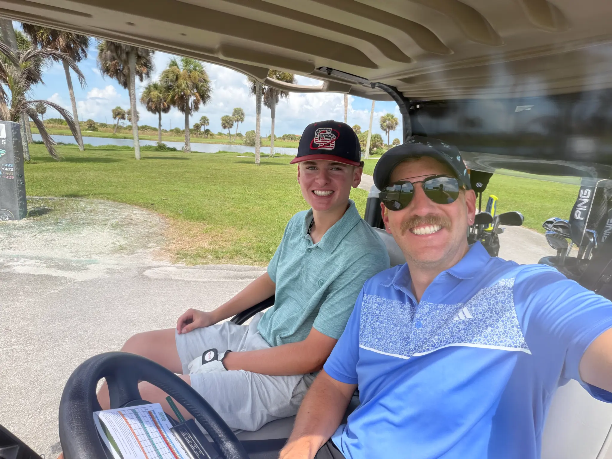 Christian Bear on a golf cart with family